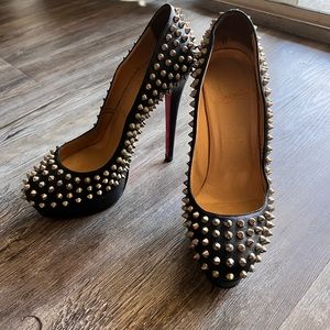 Black spiked Christian Louboutin heels.
